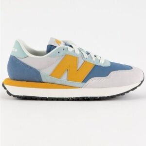 Excellent condition worn twice New Balance women's 237 Blue and Yellow Sneakers